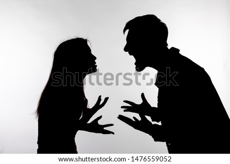 Relationship difficulties, conflict and abuse concept - man and woman face to face screaming shouting each other dispute silhouette isolated on white background Royalty-Free Stock Photo #1476559052