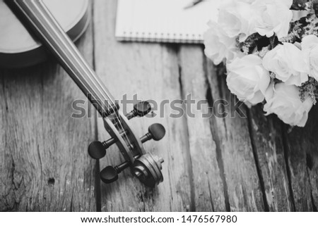 Close-up shot violin orchestra instrumental with vintage tone processed over wooden background select focus shallow depth of field