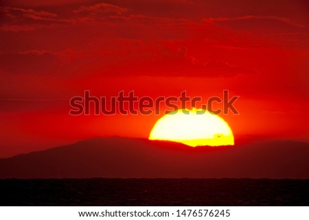 Sunset over the mountains of the Italian Apennines from the Tyrrhenian Sea near the Tremiti Islands.
