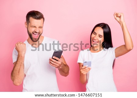 Portrait of his he her she two nice-looking attractive lovely charming winsome cheerful cheery spouses using fast speed online internet isolated over pink pastel background