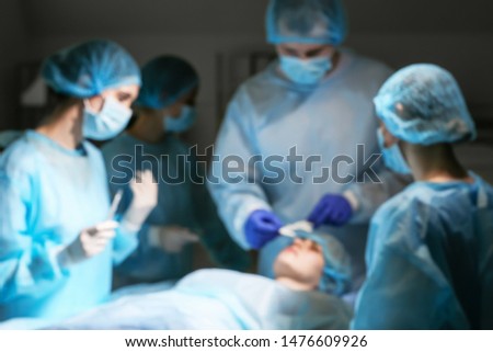 Blurred view of operation in plastic surgery clinic