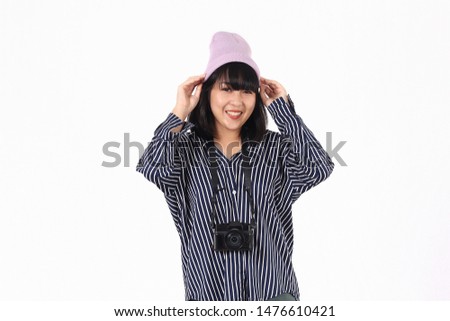 Happy young woman asian smiling holding camera and joyful her lifestyle on white background.