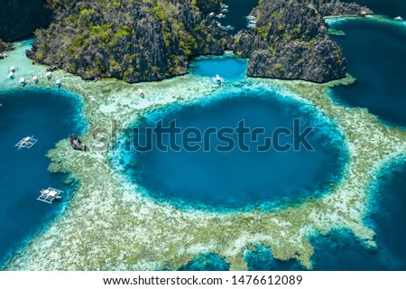 Aerial view of beautiful lagoons and limestone cliffs of Coron, Palawan, Philippines Royalty-Free Stock Photo #1476612089
