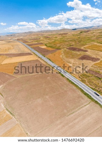 Aerial view of fields and cliffs close lake Van, Turkey. Roads along the lake
