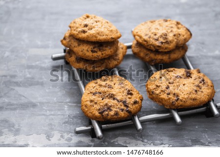 oat cookies with chocolate on ceramic background