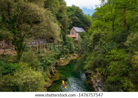 Cabrales cheese museum next to the Cares river Royalty-Free Stock Photo #1476757547