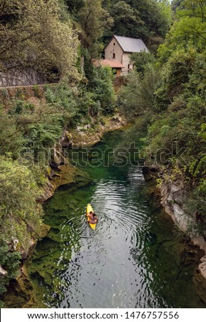 Cabrales cheese museum next to the Cares river Royalty-Free Stock Photo #1476757556