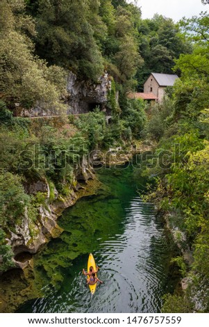 Cabrales cheese museum next to the Cares river Royalty-Free Stock Photo #1476757559