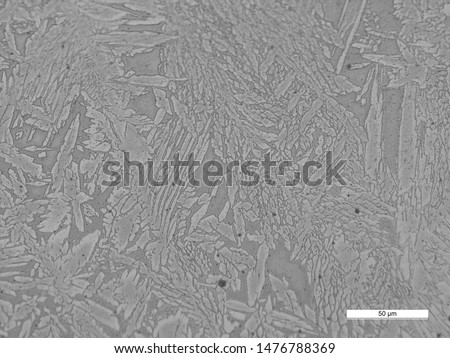 Photomicrograph of duplex stainless steel tube sheet weld showing weld, HAZ, and parent metal microstructures.  Royalty-Free Stock Photo #1476788369