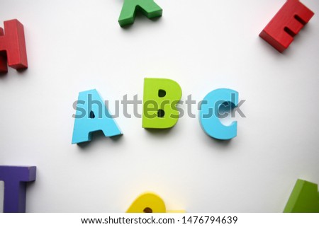 colorful alphabet letters on white background. Text abc. Soon in school. Learn English