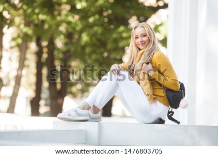Closeup portrait of young beautiful woman. Female outdoors.