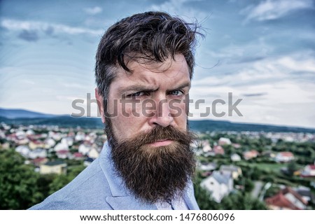 Hipster serious handsome attractive guy with long beard. Man bearded hipster with mustache blue sky background. Ultimate mustache grooming guide. Expert tips for growing and maintaining mustache.