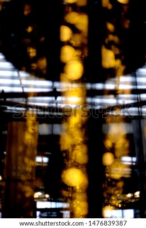 Golden bokeh of lights in the building for background, Abstract picture