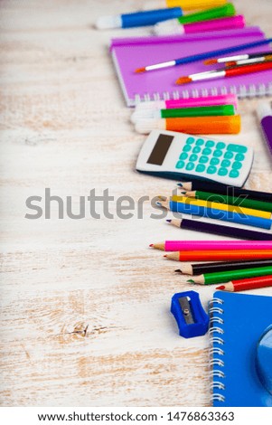 Back to school. Items for the school on a wooden table. Place for your text.