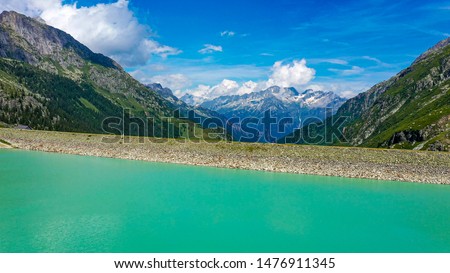 Amazing turquoise water of a glacier lake in Switzerland - aerial photography