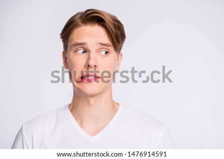 Close-up portrait of his he nice cute attractive worried uncertain guy looking aside oops mistake fail isolated over light white pastel background Royalty-Free Stock Photo #1476914591