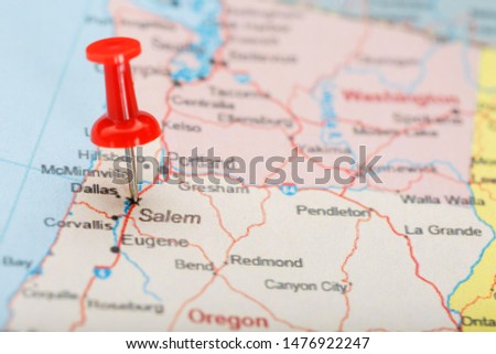 Red clerical needle on a map of USA, Oregon and the capital Salem. Closeup Map Oregon with Red Tack