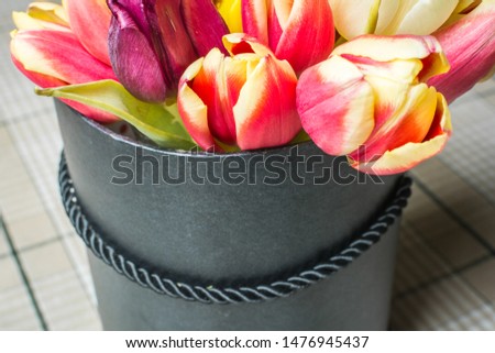 Bright and lush bouquet of flowers in gift box