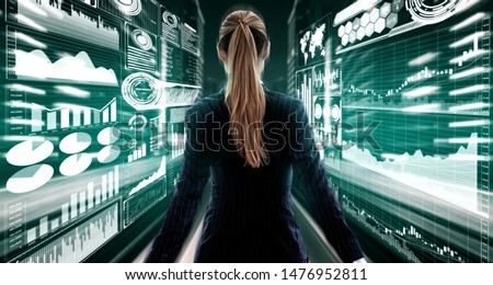 Big Data Technology for Business Finance Analytic Concept. Modern graphic interface shows massive information of business sale report, profit chart and stock market trends analysis on screen monitor. Royalty-Free Stock Photo #1476952811