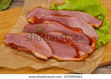 Sliced smoked duck breast served salad leaf