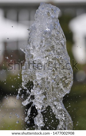 Water drops from a fountain fast shutter speed freeze frame