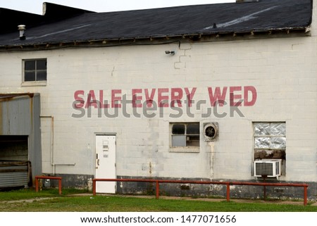 old buliding with sign sale every wed