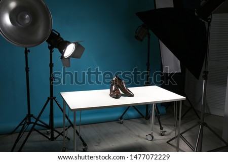 Shooting of men's shoes for product promotion in photo studio