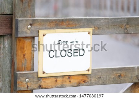 Sorry we are closed farm shop sign on wooden gate