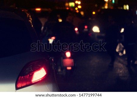 Blurred image of cars on the road with light break at in evening or night.