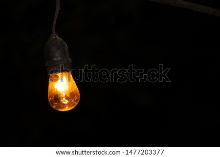 Light bulbs in the darkness Royalty-Free Stock Photo #1477203377
