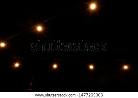 lens flare yellow light on black background
