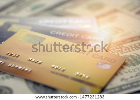 close up and selective focused of credit card on banknote background