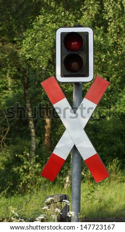 Railway crossing with traffic lights for traffic regulation
