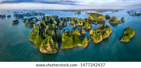 Aerial view Vung Vieng floating fishing village and rock island, Halong Bay, Vietnam, Southeast Asia. UNESCO World Heritage Site. Junk boat cruise to Ha Long Bay. Famous destination of Vietnam Royalty-Free Stock Photo #1477242437