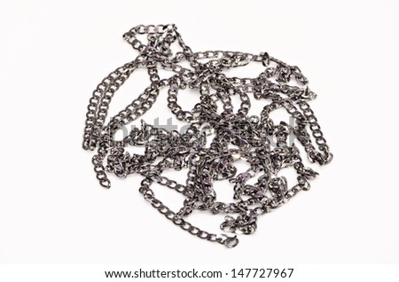 Chain in arrangement, isolated against white background.