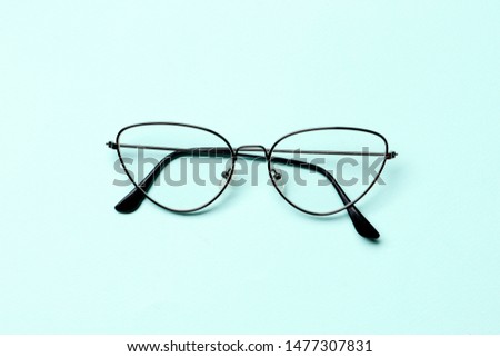 Glasses on a blue background with place for text.