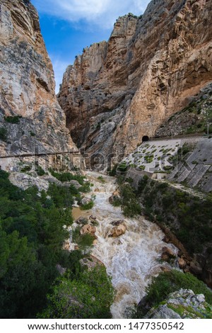 In the middle of "El caminito del rey" in Malaga with high river.