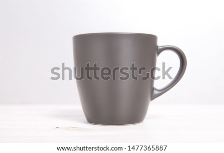 Mug Mockup. Gray Mug on wooden table closeup.