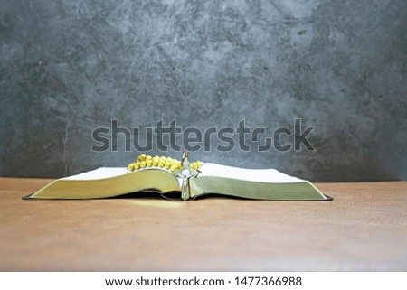 open book of holy bible and crucifix wood for background and inspiration or presentation