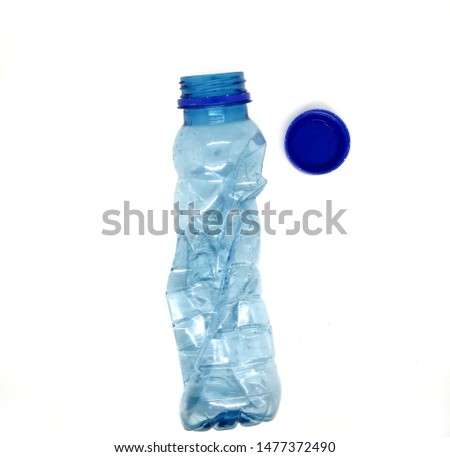 Empty crushed used plastic bottle waste, isolated on white background