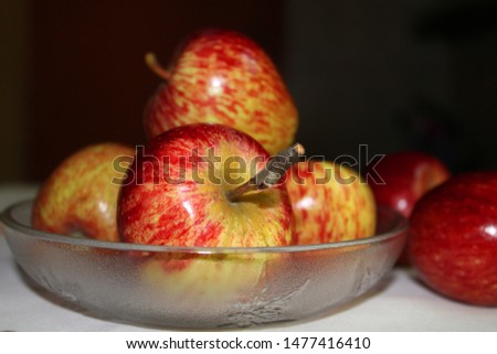 Apples in glass plate side view