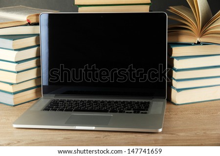 Notebook on books background