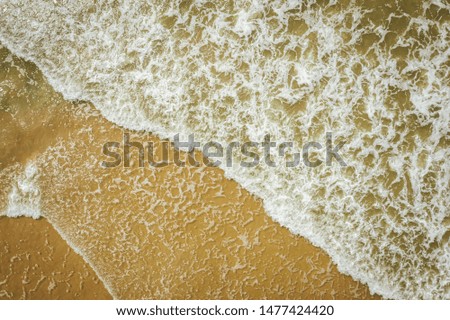 Aerial view of beach, sea waves and sand on baltic coast beach, nature background