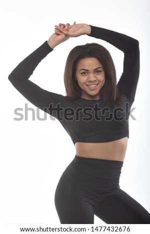 Healthy and Fitness concept - beautiful African American girl in sport clothes after workout. Isolated on white studio background.