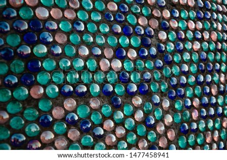 Decorative background of beautiful round-shaped blue glass mosaic