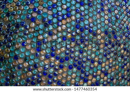 Decorative background of beautiful round-shaped blue glass mosaic