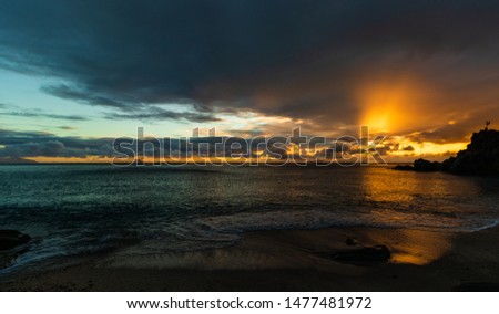 Travel photo of St. Barth’s Island (St. Bart’s Island), Caribbean. View of a peaceful sunset and waves on Shell Beach.