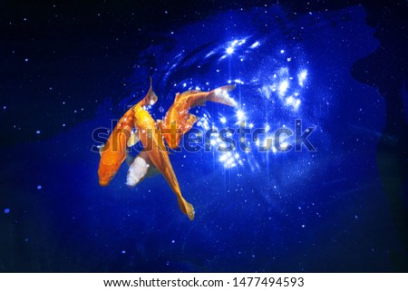 Golden koi carp fishes on dark blue sea background closeup, yellow goldfish swimming in pond at night, moonlight glow, shiny stars, artistic galaxy fantasy illustration, constellation sign, copy space