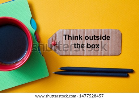 Different and positive vision or idea..Think outside the box, different way. A Cup of coffee and the inscription.