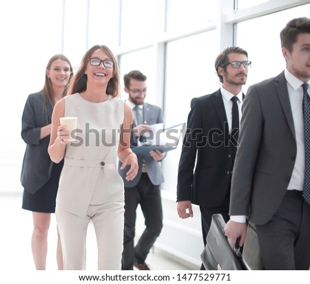employees in the office corridor during the working day